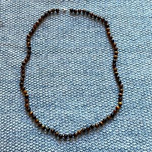 Long lapis necklace almost new the perles are dark brown and gold very heavy